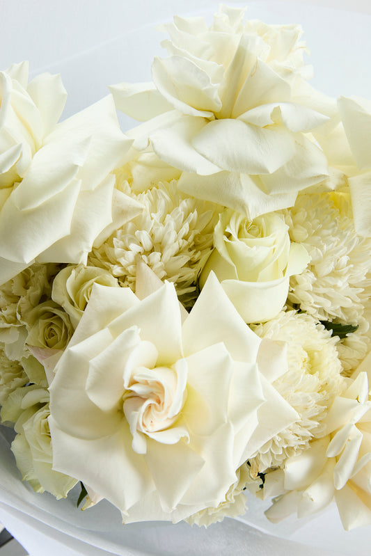 Close-up of pure grace bouquet of white flowers by flowerdose.